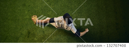 Baseball pitcher top view completing powerful throw Baseball pitcher top view completing powerful throw 132707408