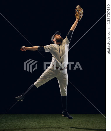 Baseball player in midair reaching to catch ball with glove extended. Baseball player in midair reaching to catch ball with glove extended. 132707480