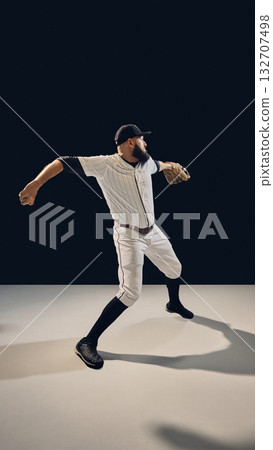 Baseball pitcher extending throwing arm demonstrating delivery technique. Baseball pitcher extending throwing arm demonstrating delivery technique. 132707498