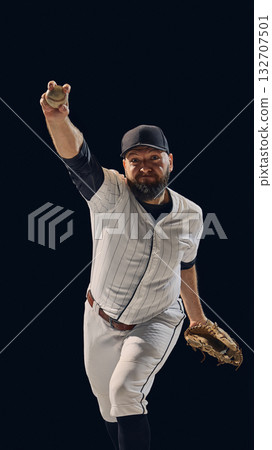 Baseball pitcher in full throw showing arm extension and release form 132707501