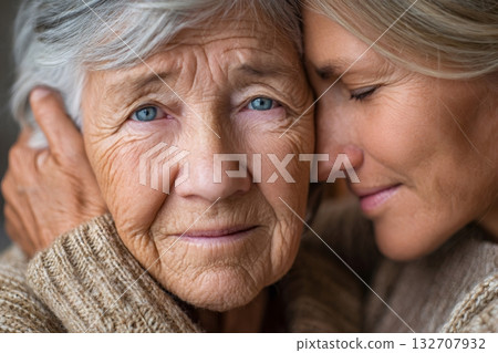 Daughter comforting elderly mother with love and care 132707932