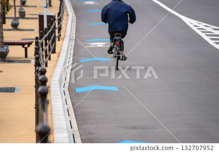 Bicycles riding in bicycle lanes on roadways 132707952