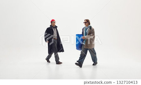 Two men in business casual streetwear walking confidently expressing creativity and teamwork 132710413