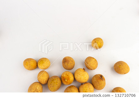 Longan Fruits Scattered and Piled on White Background Longan Fruits Scattered and Piled on White Background 132710706