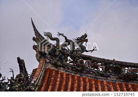 Close-up of the ornate decor on the Mengjia Longshan Temple in Taipei, Taiwan. Chinese folk religion landmark. Buddhist Temple. Religious and traditional Chinese art.  132710745