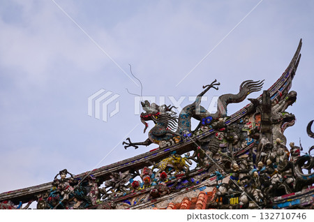 Close-up of the ornate decor on the Mengjia Longshan Temple in Taipei, Taiwan. Chinese folk religion landmark. Buddhist Temple. Religious and traditional Chinese art.  132710746
