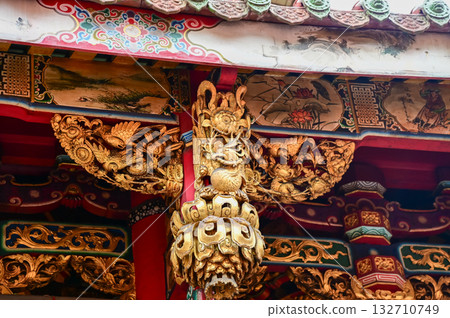 Close-up of the ornate decor on the Mengjia Longshan Temple in Taipei, Taiwan. Chinese folk religion landmark. Buddhist Temple. Religious and traditional Chinese art.  132710749