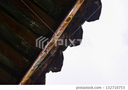 Close-up of the ornate decor on the Mengjia Longshan Temple in Taipei, Taiwan. Chinese folk religion landmark. Buddhist Temple. Religious and traditional Chinese art.  132710753