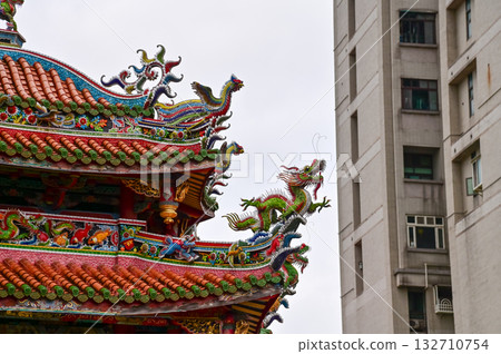 Close-up of the ornate decor on the Mengjia Longshan Temple in Taipei, Taiwan. Chinese folk religion landmark. Buddhist Temple. Religious and traditional Chinese art.  132710754