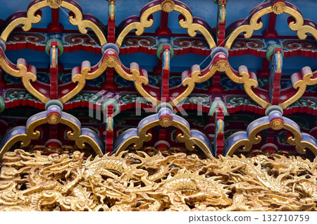 Close-up of the ornate decor on the Mengjia Longshan Temple in Taipei, Taiwan. Chinese folk religion landmark. Buddhist Temple. Religious and traditional Chinese art.  132710759