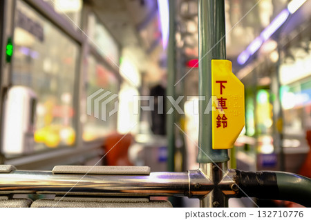 Close-up of the "get off bell" in the bus. One of the Taiwan public transportation. Transportation concept.Translation: Get off bell. Close-up of the "get off bell" in the bus. One of the Taiwan public transportation. Transportation concept.Translation: Get off bell. 132710776