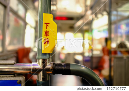 Close-up of the "get off bell" in the bus. One of the Taiwan public transportation. Transportation concept.Translation: Get off bell. Close-up of the "get off bell" in the bus. One of the Taiwan public transportation. Transportation concept.Translation: Get off bell. 132710777