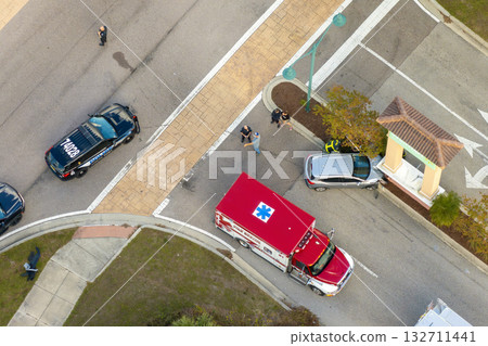 Car accident on city street in Florida. Result of distracted driving and speeding. Emergency services at vehicle crash in USA 132711441