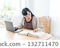 Young woman studying at home 132711470