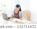 Young woman studying at home 132711472