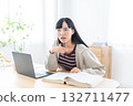 Young woman studying at home 132711477