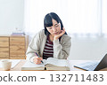 Young woman studying at home 132711483