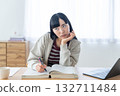 Young woman studying at home 132711484
