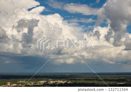 Blue sky with white clouds over rural Florida town. Bright summer skyscape Blue sky with white clouds over rural Florida town. Bright summer skyscape 132711504