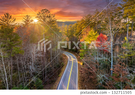 Blue Ridge Parkway in autumn. Mountain pass road between dense woods in seasonal colors in North Carolina Blue Ridge Parkway in autumn. Mountain pass road between dense woods in seasonal colors in North Carolina 132711505