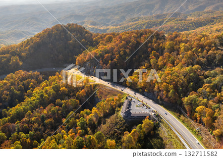 American highway in North Carolina Appalachian mountains in fall season with fast moving traffic. Interstate transportation concept American highway in North Carolina Appalachian mountains in fall season with fast moving traffic. Interstate transportation concept 132711582