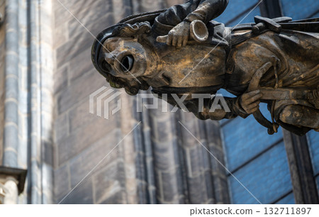 Prague, Czech Republic, August 8, 2023. Close-up view of a gargoyle on St. Vitus Cathedral. Beautiful summer day. Travel destinations. Prague, Czech Republic, August 8, 2023. Close-up view of a gargoyle on St. Vitus Cathedral. Beautiful summer day. Travel destinations. 132711897