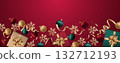 Festive arrangement of gifts and ornaments on rich red backdrop 132712193