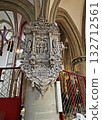 This photo shows a lavish baroque stone memorial inside a cathedral in Osnabruk, covered with intricate carvings, statues, and Latin inscriptions. 132712561