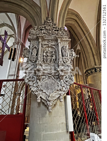This photo shows a lavish baroque stone memorial inside a cathedral in Osnabruk, covered with intricate carvings, statues, and Latin inscriptions. This photo shows a lavish baroque stone memorial inside a cathedral in Osnabruk, covered with intricate carvings, statues, and Latin inscriptions. 132712561