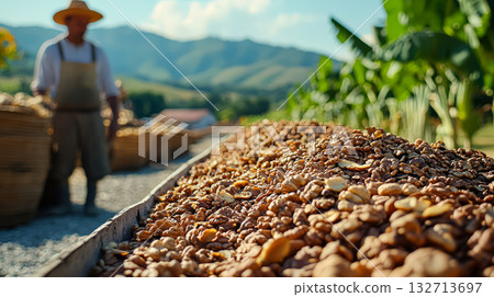 Man is standing in front of a pile of nuts Man is standing in front of a pile of nuts 132713697