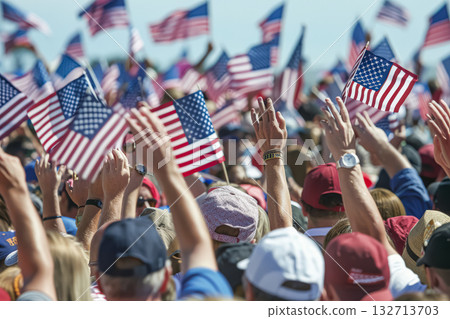 Crowd of people are holding up American flags Crowd of people are holding up American flags 132713703