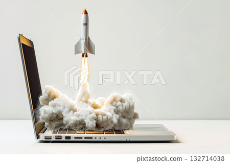 Laptop computer is opened to reveal a rocket launching from the screen 132714038
