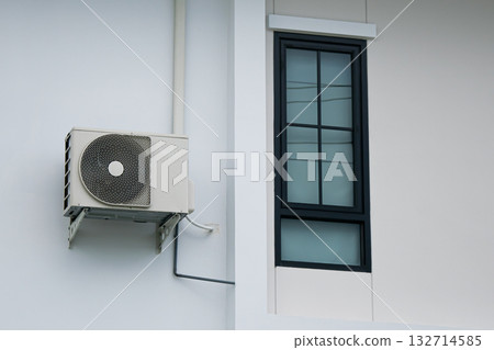 Hot coil of air conditioner installed outside the building 132714585