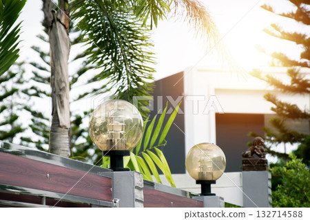 Decorative lamps on the top of the fence posts Decorative lamps on the top of the fence posts 132714588