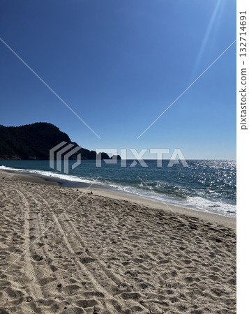 Beach waves footprints. High quality photo 132714691