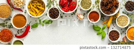 Colorful, fresh herbs and spices framing a gray background, a perfect natural border to bring attention to culinary creativity, top view and copy space, banner Colorful, fresh herbs and spices framing a gray background, a perfect natural border to bring attention to culinary creativity, top view and copy space, banner 132714875