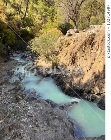 stream in the mountains against the backdrop of nature spring in the mountains against the backdrop of nature. High quality photo stream in the mountains against the backdrop of nature spring in the mountains against the backdrop of nature. High quality photo 132714997