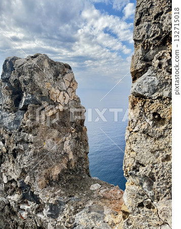 stone wall ruins mountain sea horizon cloudy. High quality photo 132715018