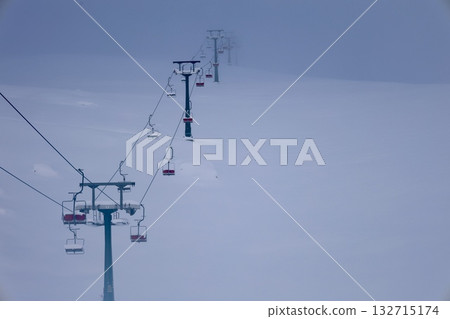Snowy mountain ski-lift no people, blue sky, azure, air, freshness, ecology. High quality photo Snowy mountain ski-lift no people, blue sky, azure, air, freshness, ecology. High quality photo 132715174