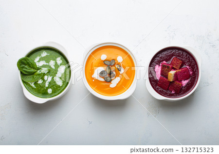 Three bowls colourful vegetable soups white background healthy diet cooking detox 132715323