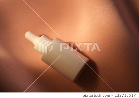 Bottles of facial serum in the soft sunset light. Bottles of facial serum in the soft sunset light. 132715517