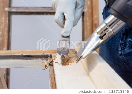 Carpenter at work, restoring an old wooden window. Carpentry. Carpenter at work, restoring an old wooden window. Carpentry. 132715546