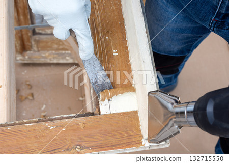 Carpenter at work, restoring an old wooden window. Carpentry. 132715550