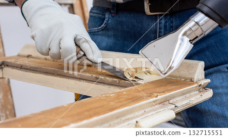 Carpenter at work, restoring an old wooden window. Carpentry. Carpenter at work, restoring an old wooden window. Carpentry. 132715551