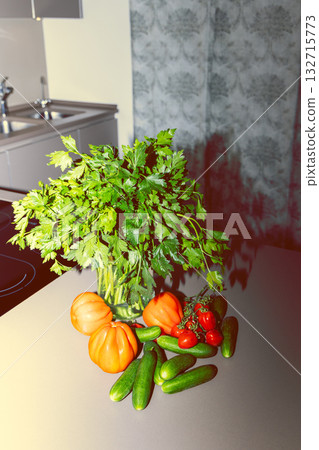 Retro kitchen composition with parsley tomatoes and cucumbers captured with bright flash light Retro kitchen composition with parsley tomatoes and cucumbers captured with bright flash light 132715773