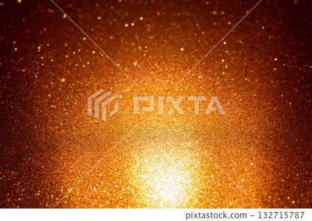 Radiant golden glitter texture ignited from bottom expanding upward with countless shining sparkles Radiant golden glitter texture ignited from bottom expanding upward with countless shining sparkles 132715787