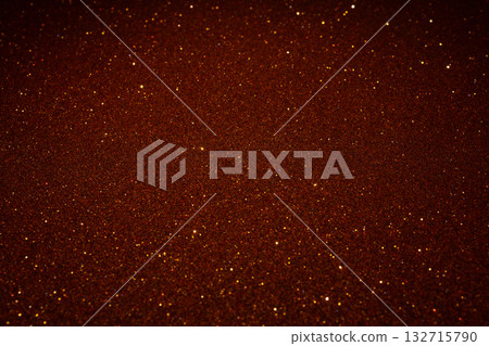 Shimmering copper glitter surface glowing richly across frame with soft illumination and texture Shimmering copper glitter surface glowing richly across frame with soft illumination and texture 132715790