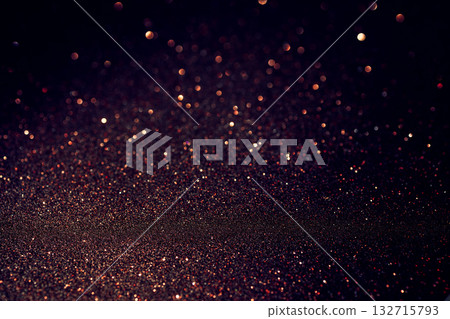 Copper glitter texture glowing warmly below with upper blur of luminous dreamy bokeh highlights Copper glitter texture glowing warmly below with upper blur of luminous dreamy bokeh highlights 132715793