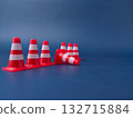 The image shows several miniature traffic cones, with one lying on its side. 132715884