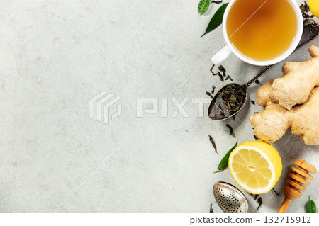Herbal Tea with Ginger, Lemon, and Honey on Light Background 132715912